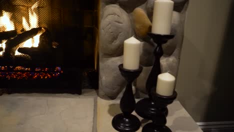 brick fireplace and wood burning fire with flickering flames. warp pano from right to left gas fireplace. warm fireplace flames provide cozy interior.