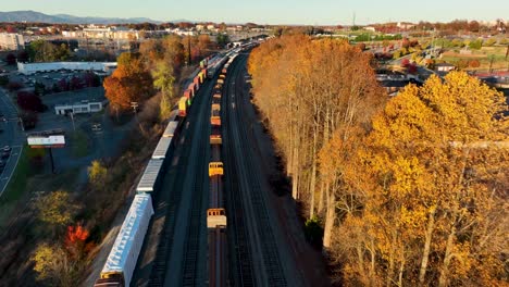 aerial of drone flight above railroad train car on track