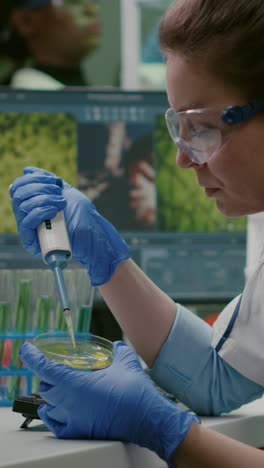 scientist conducting research in a laboratory with pipette and petri dish
