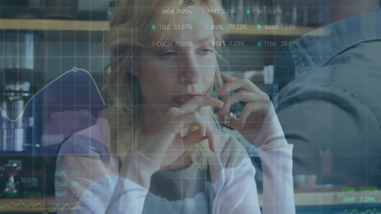 On phone, businesswoman with animation of financial data and graphs in office