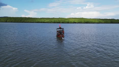 longtail boat on a tropical river in thailand