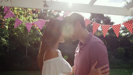 Caucasian-couple-enjoying-their-time-together-in-a-garden