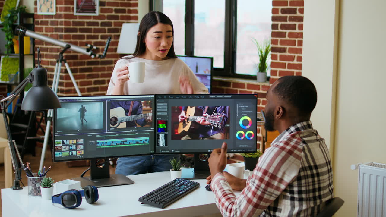 Creative team interracial partners collaborating on a video editing project