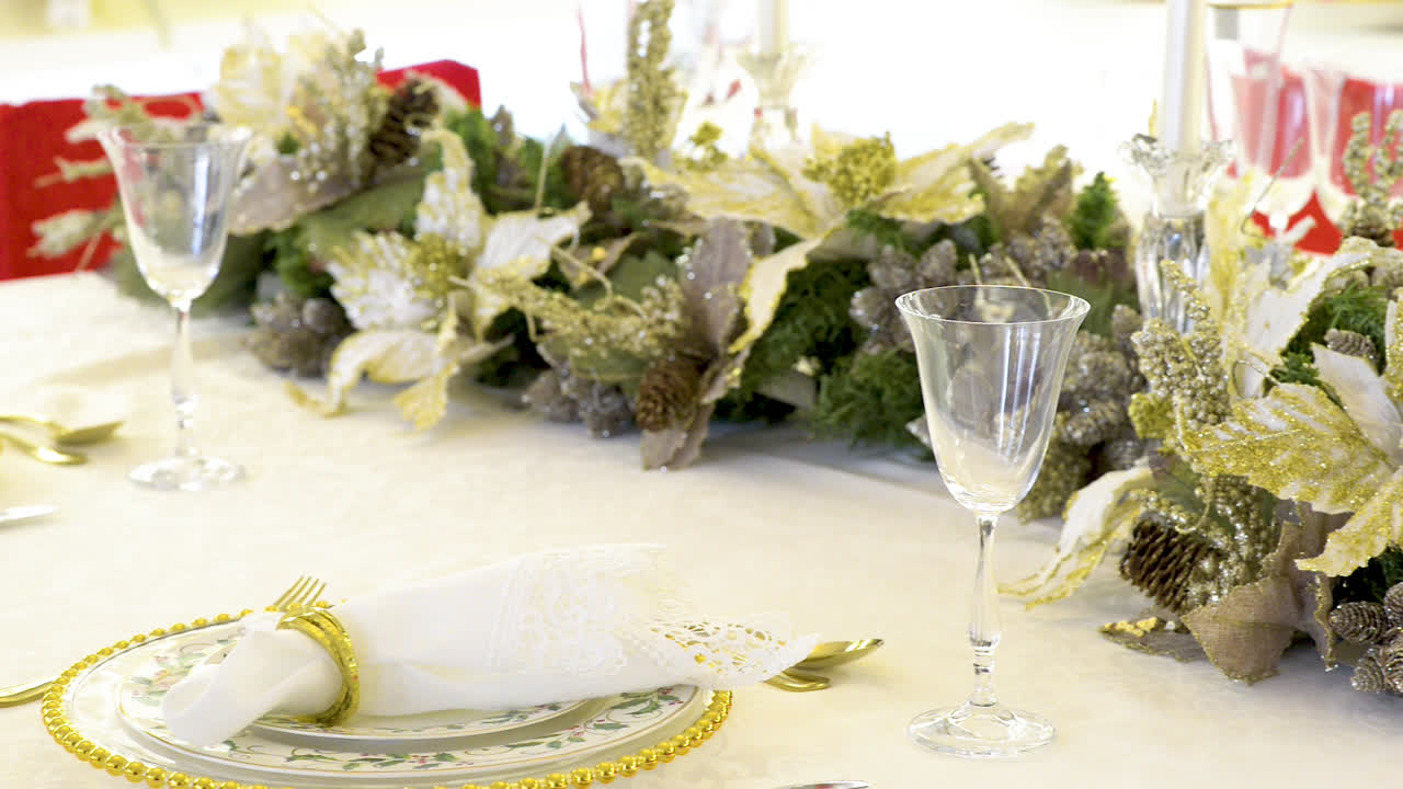 Table decorated for Christmas with white poinsettias