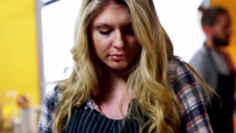 waitress using mobile phone