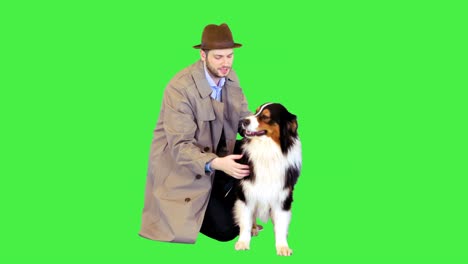 detective petting his australian shepherd dog on a green screen, chroma key