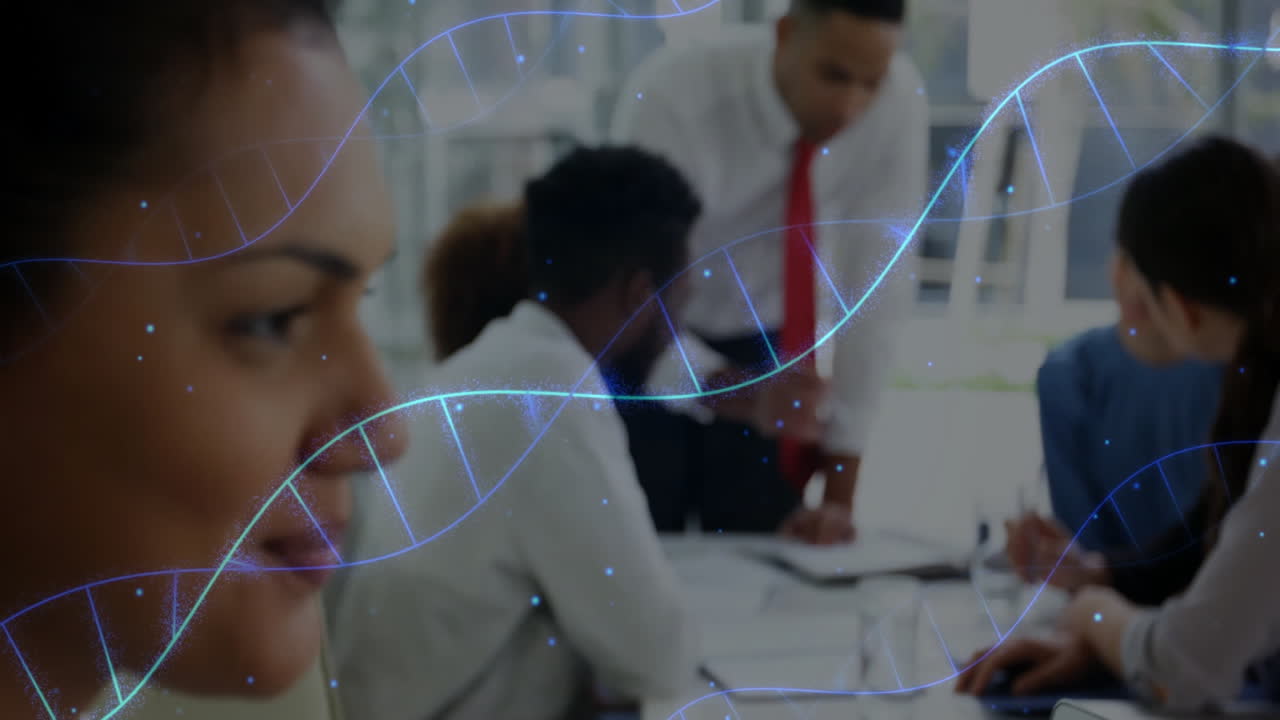 DNA strand animation over diverse business team collaborating in office