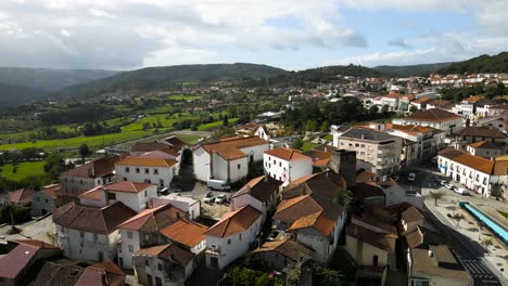 drone pullback above orange roof castle and town of vinhais, braganza, portugal