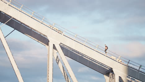 firework technician man climbing stairs on top of