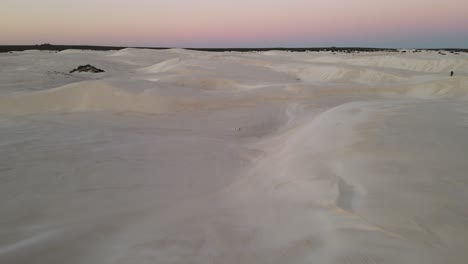 Drone-video-of-desert-at-sunset-with-pink-glow