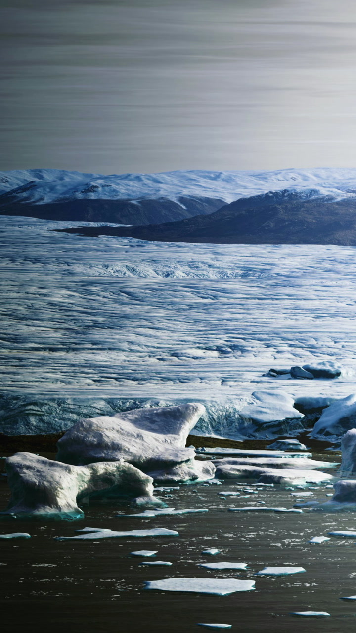 Icebergs drift serenely in a gentle glacial landscape under a soft sky