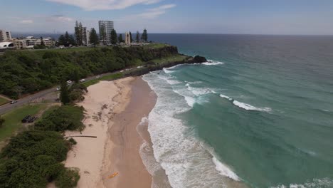 ocean waves splashing at duranbah beach in tweed heads, nsw, australia - drone shot