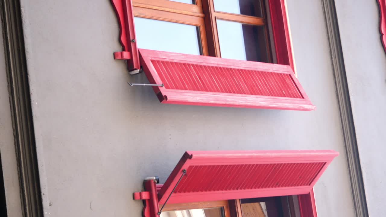Red Shutters on a Building