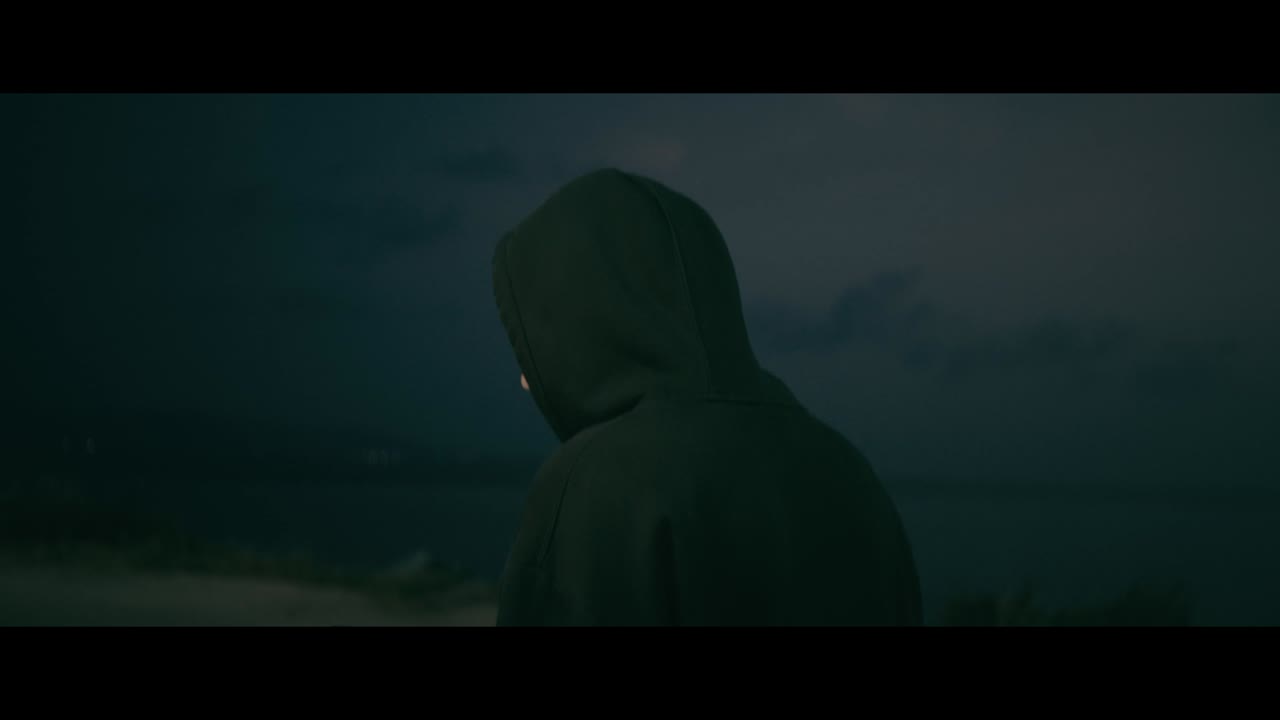 Person in Hoodie at Night
