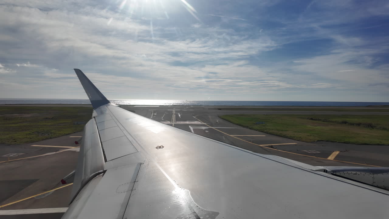 View from an airplane window of an aircraft landing at the airport