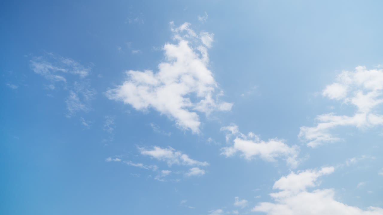 Residential towers and apartments visible beyond a lush, green, forested hillside