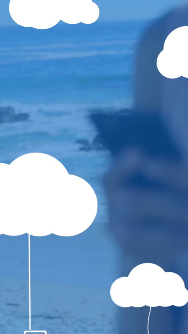 Animation of clouds with electronic devices over caucasian woman using smartphone