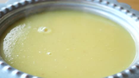 creamy lentil soup in a metal bowl