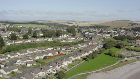 an aerial view of inverbervie looking over the town from the sea on a sunny summer's day