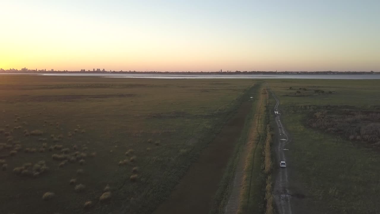 Drone view of the skyline of Santa Fe, Argentina, during the sunset from the countryside.