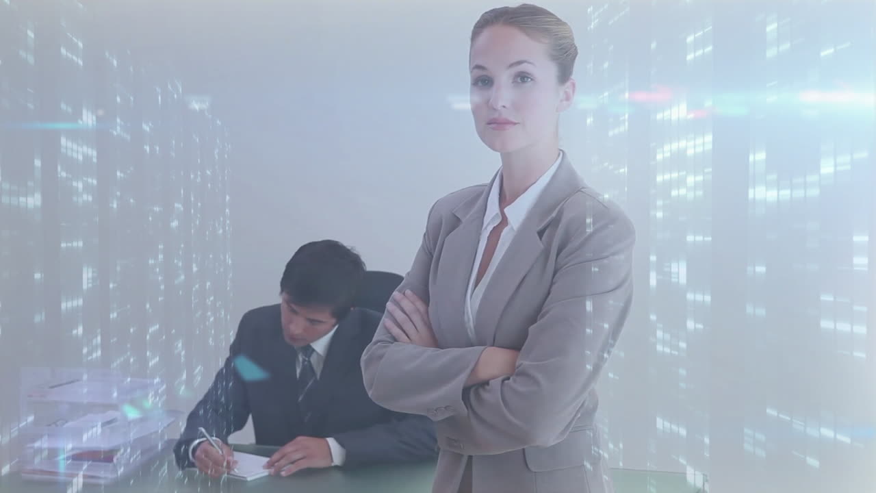 Businesswoman standing confidently with arms crossed over digital data animation