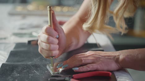 woman crafting with glass