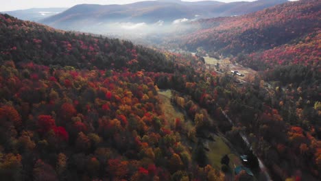 breathtaking scenic landscapes of fall colors covering vermont hillsides, aerial dolly out