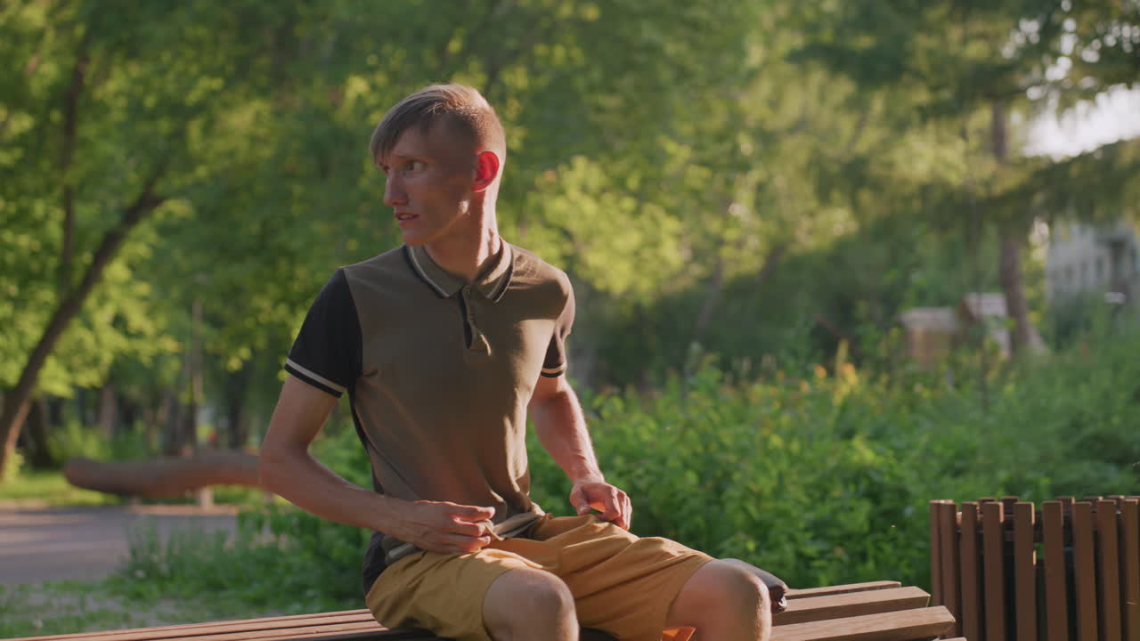 Man Taps Legs, Restless Individual Consistently Presses His Hand Against His Thighs While Sitting, Nervous Man Continuously Drumming His Thighs And Fidgeting During His Seated Position