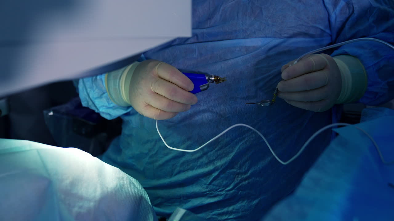 Doctor during eye surgery process. Surgeon in the operating room during ophthalmic surgery