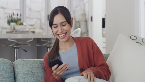 Cheerful-woman-cheering-excitedly-using-a-phone