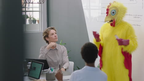 funny business meeting team leader chicken presenting financial market strategy on whiteboard corporate management team sharing creative ideas colorful bird boss in office presentation