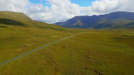 empty road passing through grassland 4k