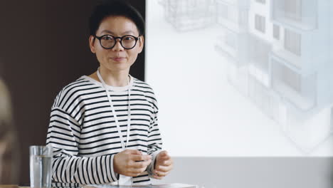 asian female architect giving presentation on conference