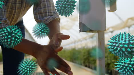 animation of macro coronavirus covid-19 cells spreading over man washing his hands