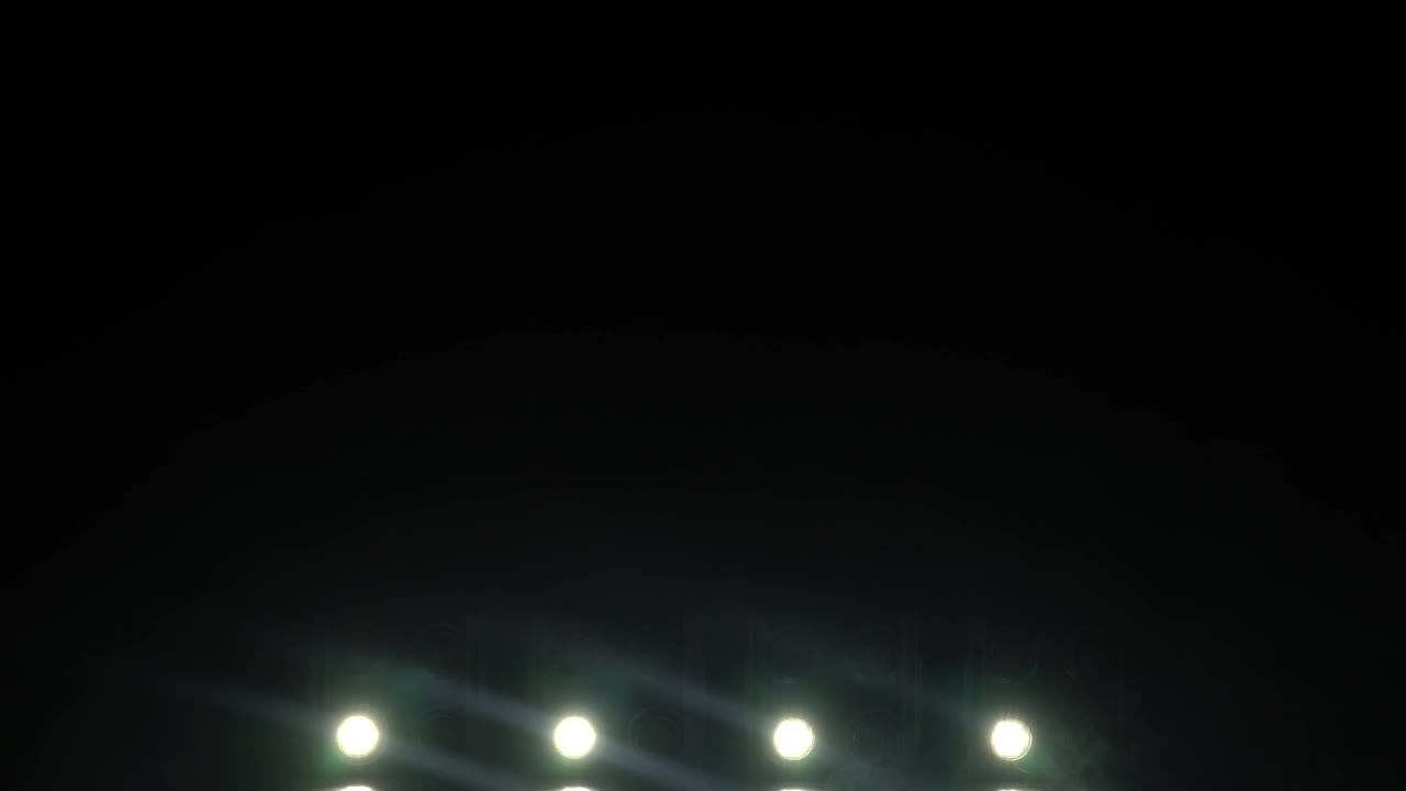 Set of concert lights flashing and moving on stage