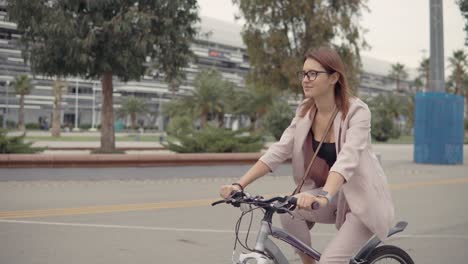 woman cycling in an urban park