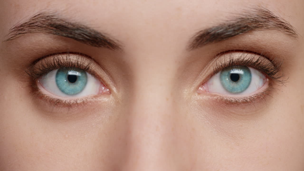 close up macro blue eyes opening natural human beauty