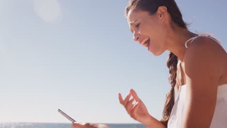 Woman-laughing-in-front-of-her-smartphone-