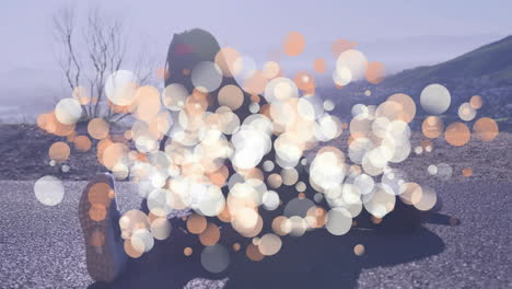 stretching on road, person surrounded by bokeh light animation, exercising outdoors