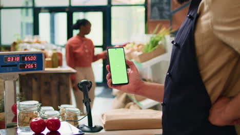 Young-man-holds-smartphone