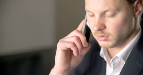 Businessman-Using-His-Smart-Phone