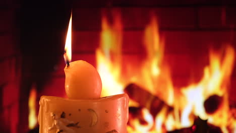 christmas candle in front of fireplace