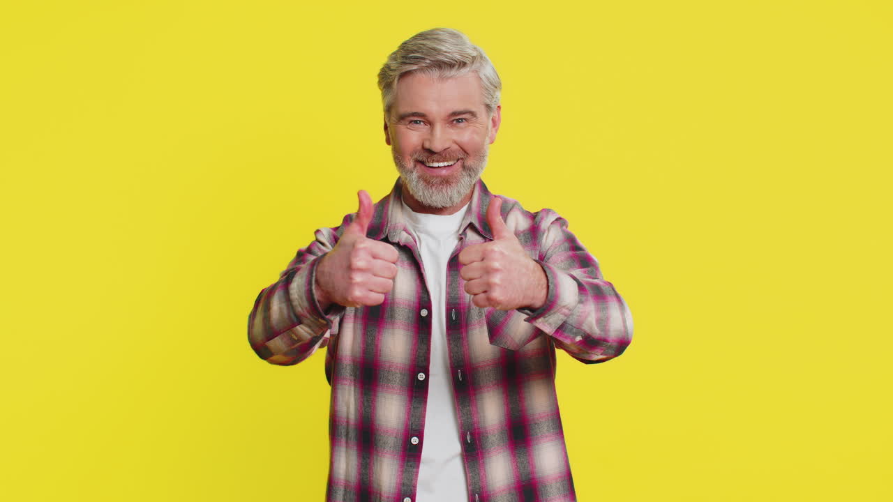 Caucasian man raises thumbs up agrees give positive reply recommends advertisement likes good idea