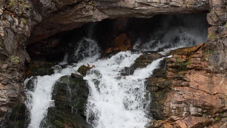 Close-up-of-a-beautiful-waterfall-in-Glacier-National-Park,-Running-Eagle-Falls-named-after-a-female-warrior-Native-American