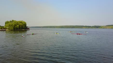 young children kayaking on river. people in boat rowing in kayak over the river