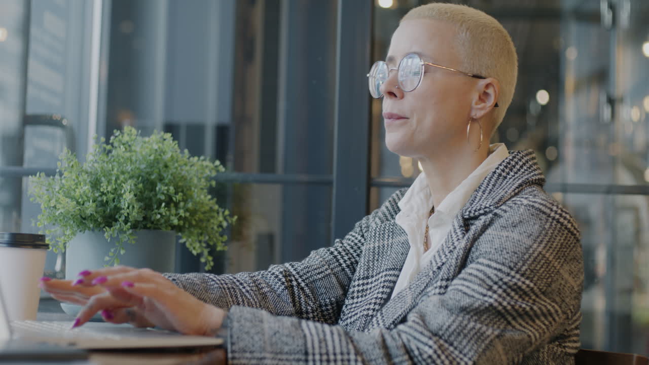 Woman Working in a Cafe