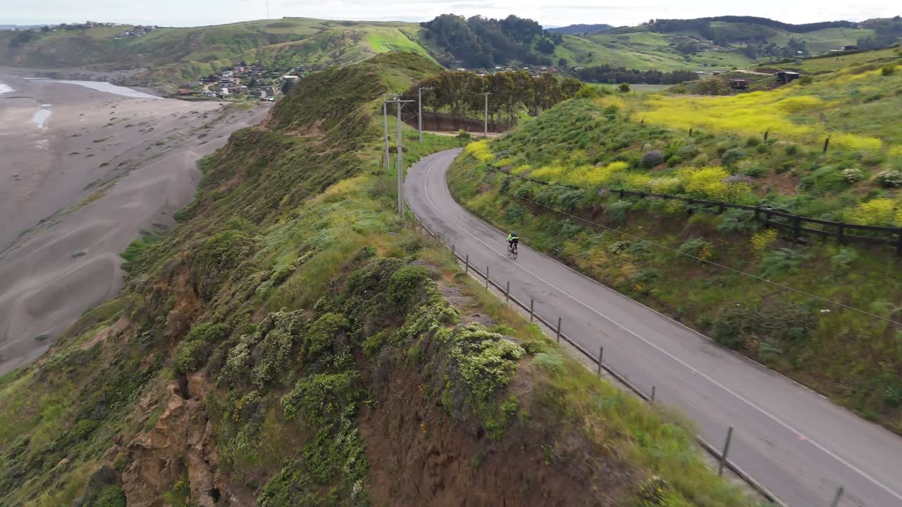 Cyclists pedaling at high speed through Matanzas, Navidad commune, Ohiggins region, Chile