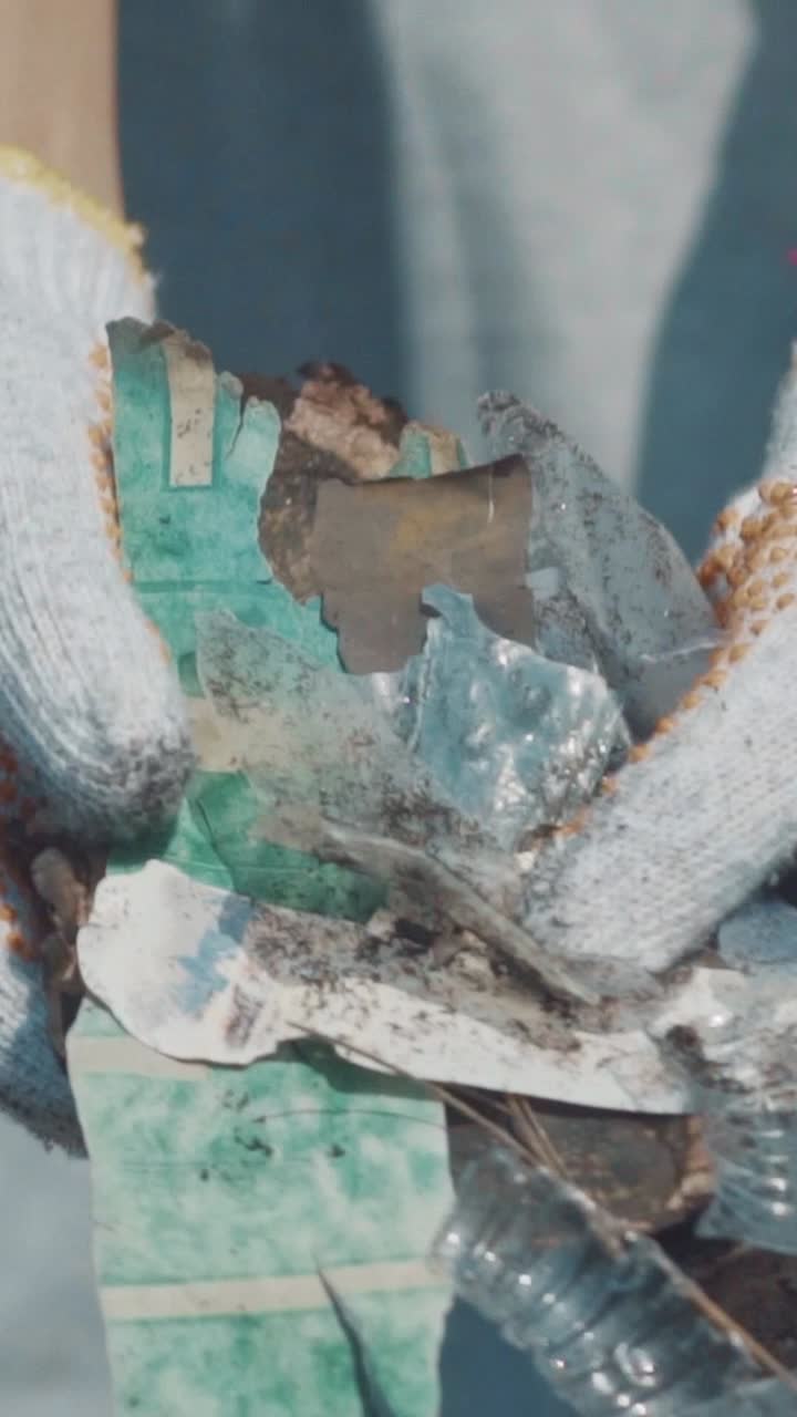 Volunteer cleans plastic waste from beautiful bali beach