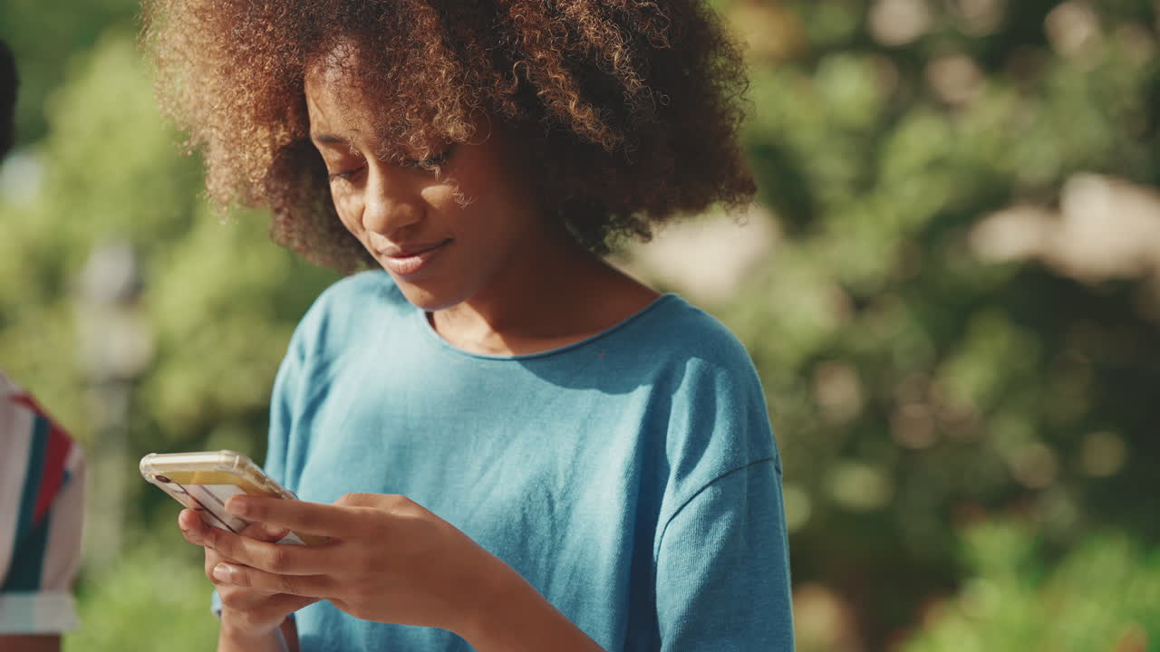 Woman using phone outdoors