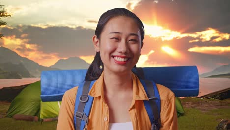 happy woman on camping trip at sunrise